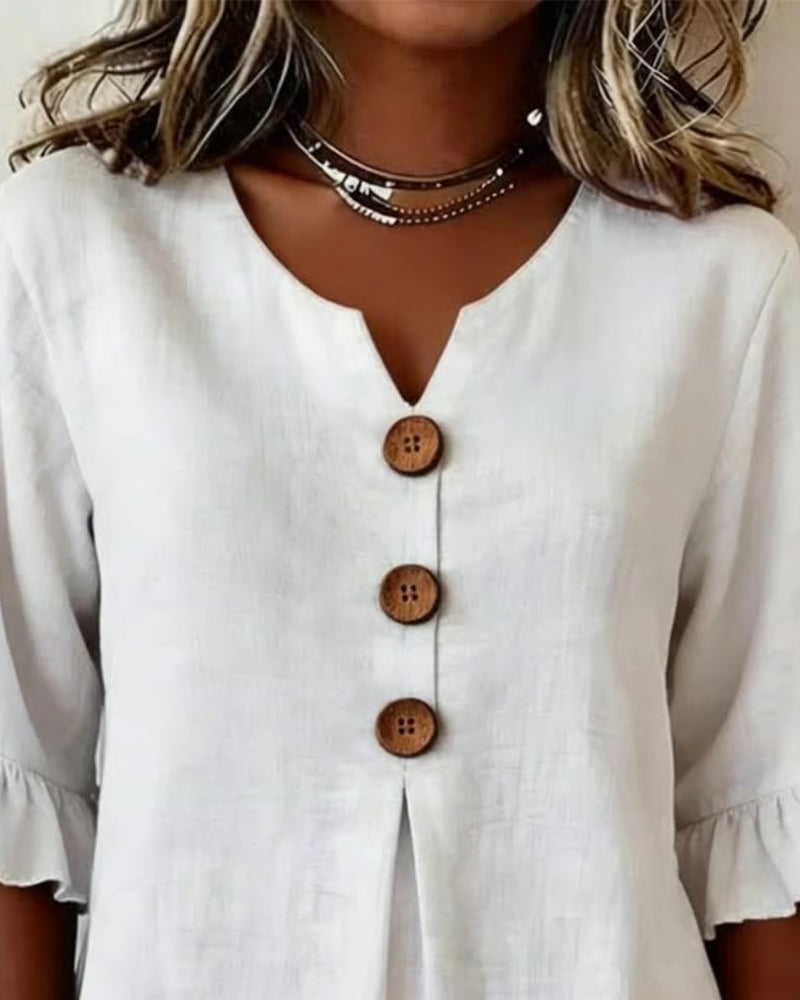 Blusa Sophia de algodón-lino con botones de madera y volantes