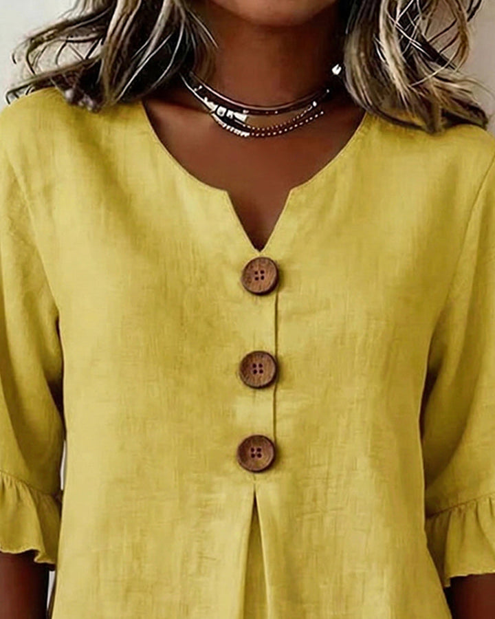 Blusa Sophia de algodón-lino con botones de madera y volantes