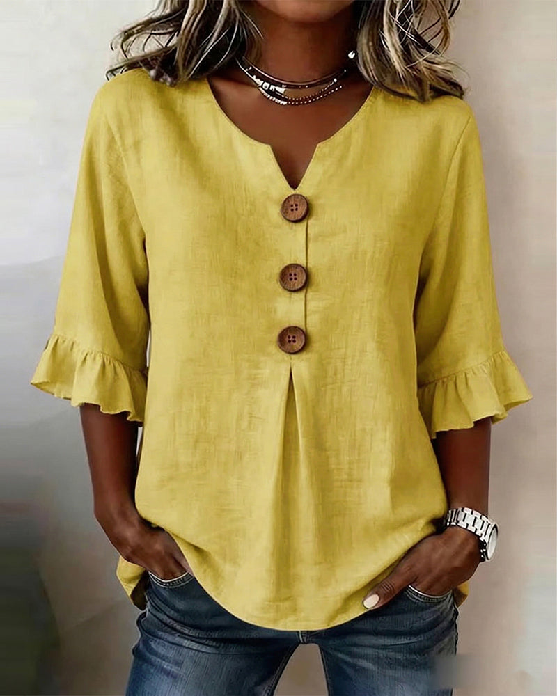 Blusa Sophia de algodón-lino con botones de madera y volantes