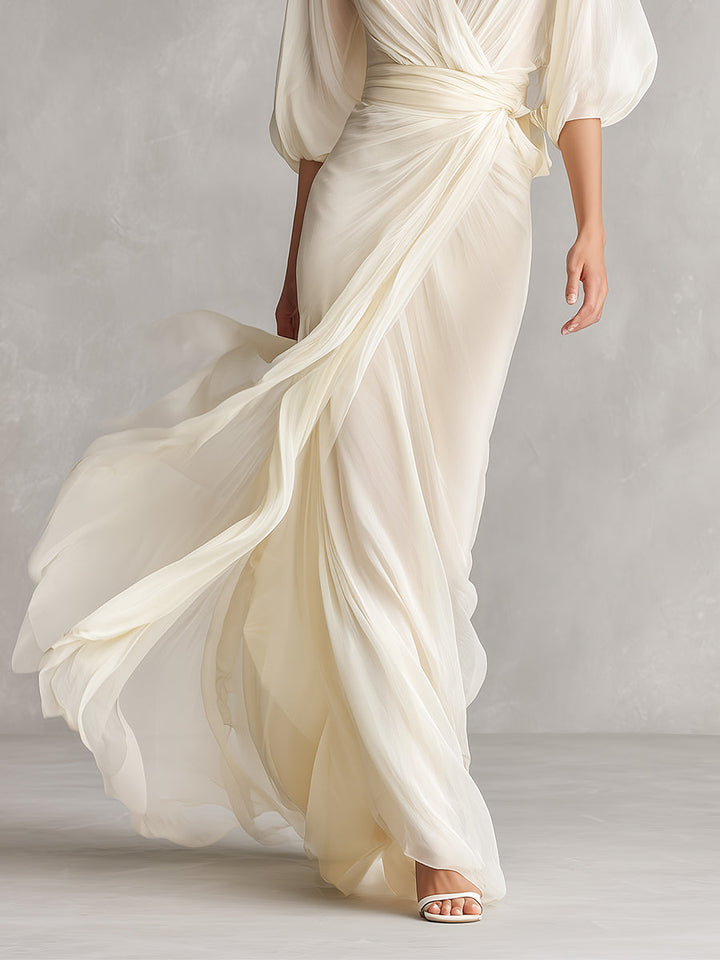 VESTIDO MAXI DE GASA MARFIL CON MANGAS ABULLONADAS Y ESCOTE CRUZADO