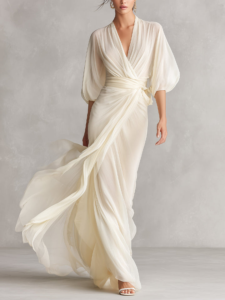 VESTIDO MAXI DE GASA MARFIL CON MANGAS ABULLONADAS Y ESCOTE CRUZADO